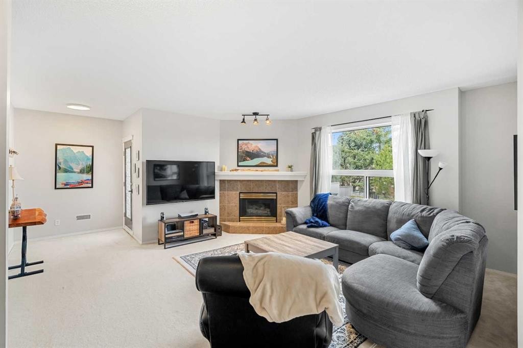 94 Edgebrook Heights Nw, Calgary, AB - Indoor Photo Showing Living Room With Fireplace