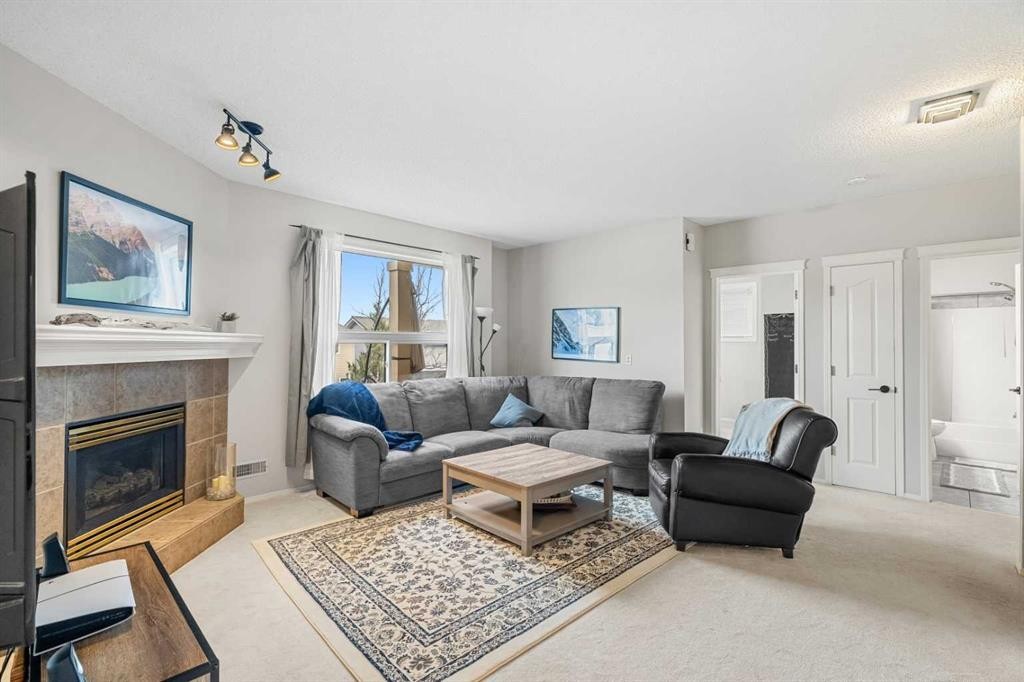 94 Edgebrook Heights Nw, Calgary, AB - Indoor Photo Showing Living Room With Fireplace