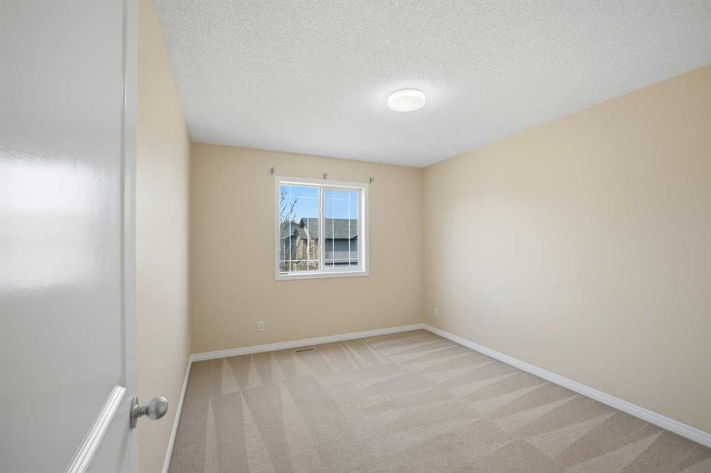 35 Saddlebrook Link Ne, Calgary, AB - Indoor Photo Showing Other Room