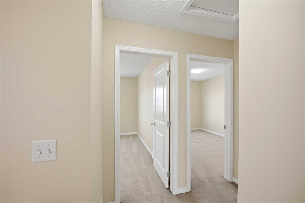 35 Saddlebrook Link Ne, Calgary, AB - Indoor Photo Showing Other Room