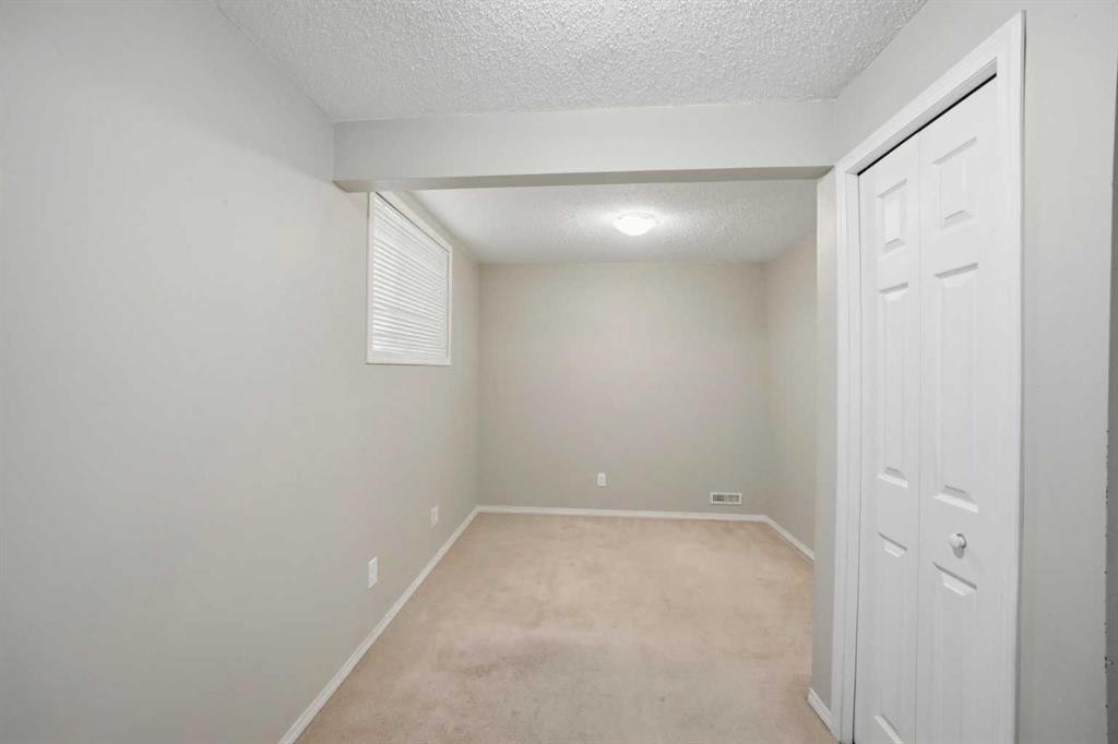 35 Saddlebrook Link Ne, Calgary, AB - Indoor Photo Showing Other Room