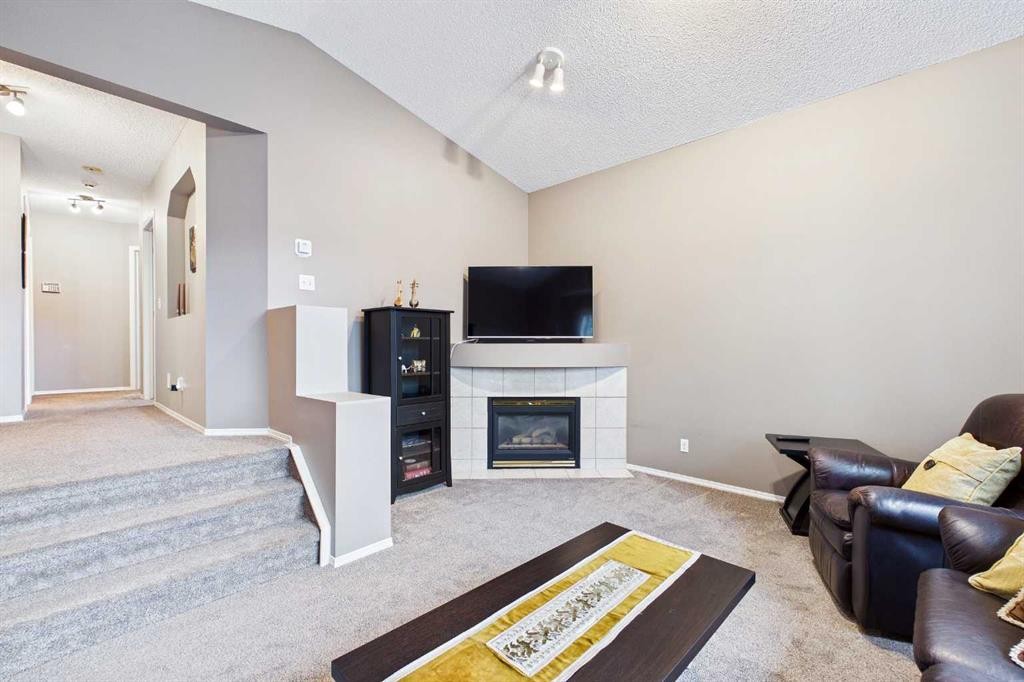 279 Valley Brook Circle Nw, Calgary, AB - Indoor Photo Showing Living Room With Fireplace