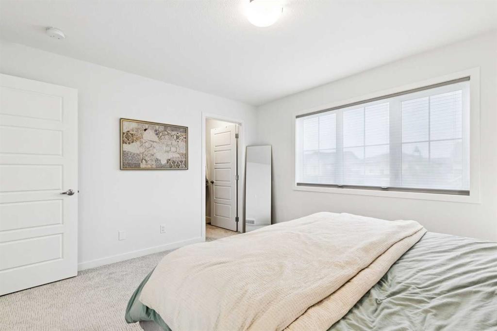 44 Creekside Boulevard Sw, Calgary, AB - Indoor Photo Showing Bedroom