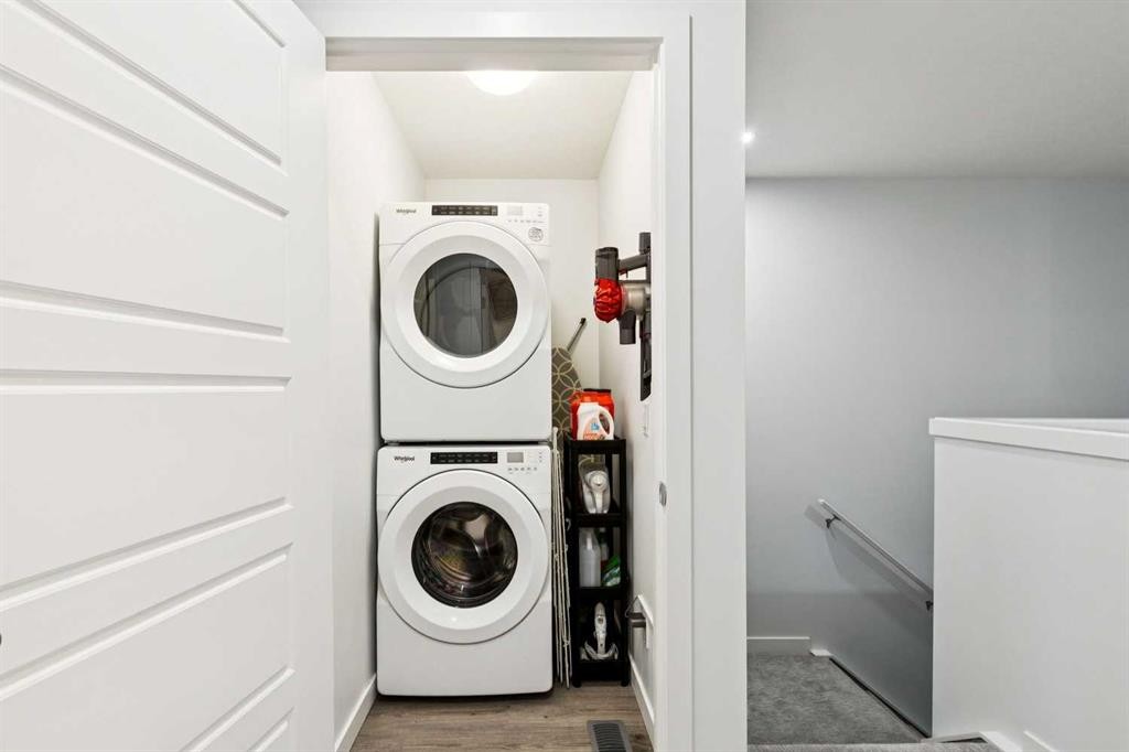 44 Creekside Boulevard Sw, Calgary, AB - Indoor Photo Showing Laundry Room