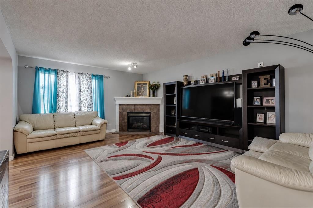 47 Westmount Road, Okotoks, AB - Indoor Photo Showing Living Room With Fireplace