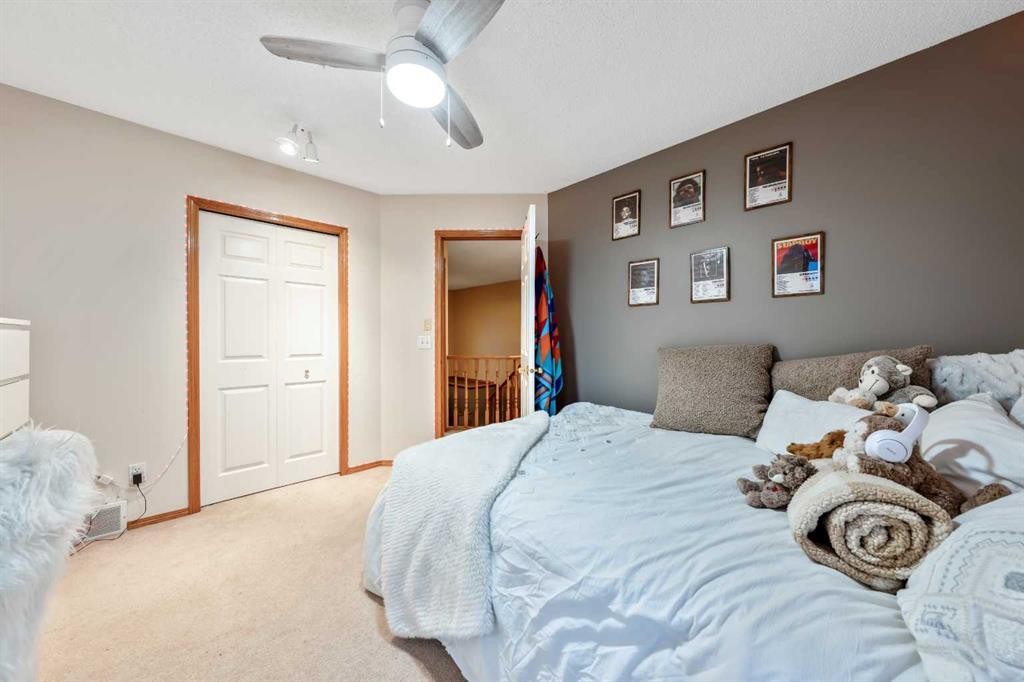 46 4 Street Ne, Langdon, AB - Indoor Photo Showing Bedroom