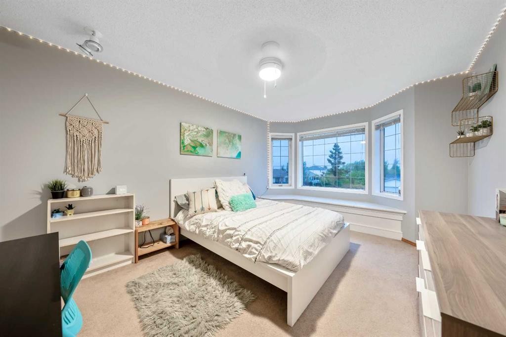 46 4 Street Ne, Langdon, AB - Indoor Photo Showing Bedroom