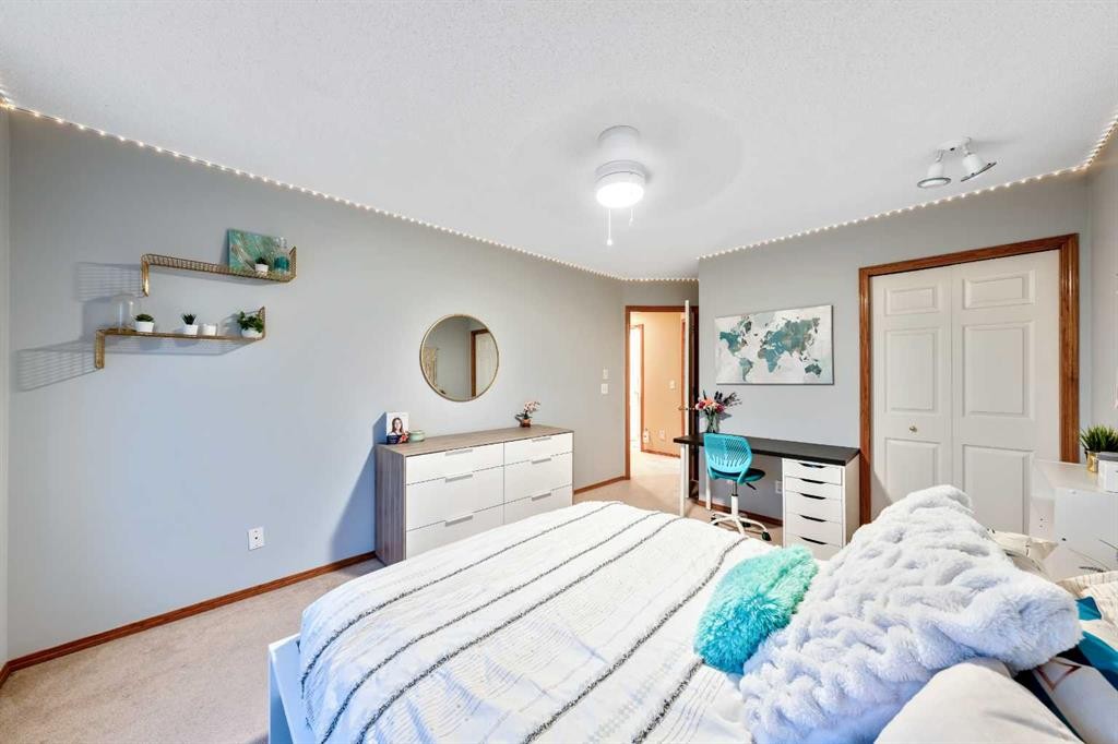46 4 Street Ne, Langdon, AB - Indoor Photo Showing Bedroom