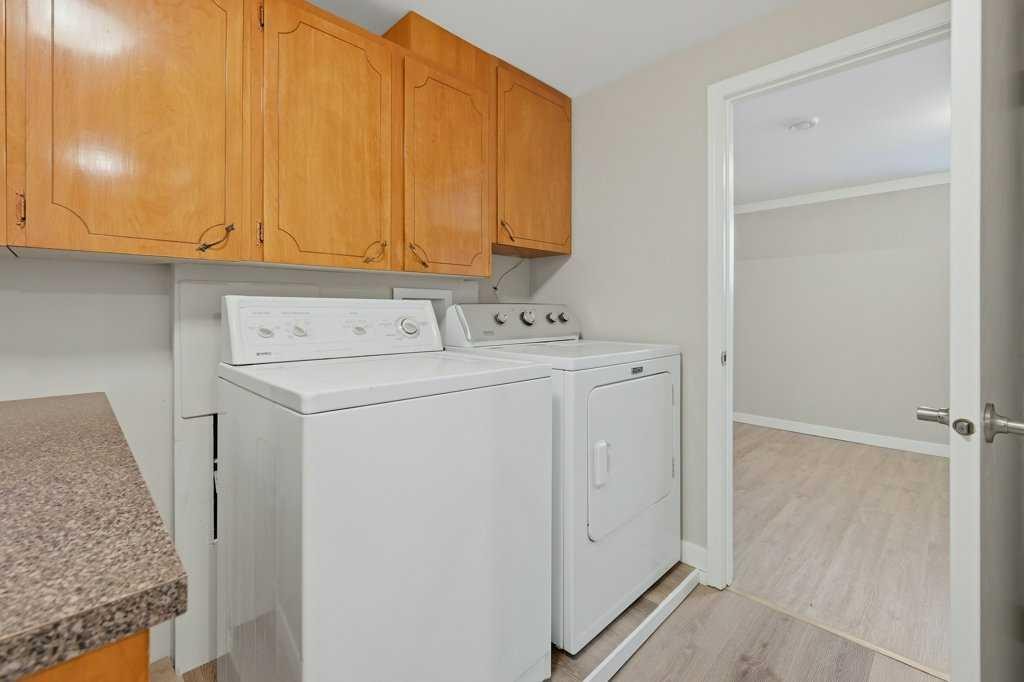 7115 Huntercrest Road Nw, Calgary, AB - Indoor Photo Showing Laundry Room