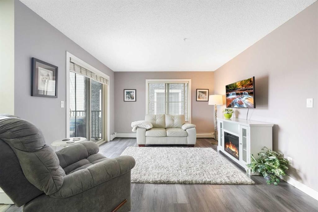 1219-625 Glenbow Drive, Cochrane, AB - Indoor Photo Showing Living Room With Fireplace