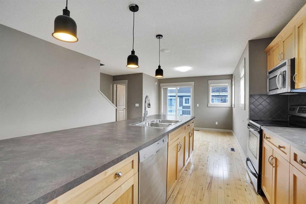 124 Lavender Link, Chestermere, AB - Indoor Photo Showing Kitchen With Double Sink