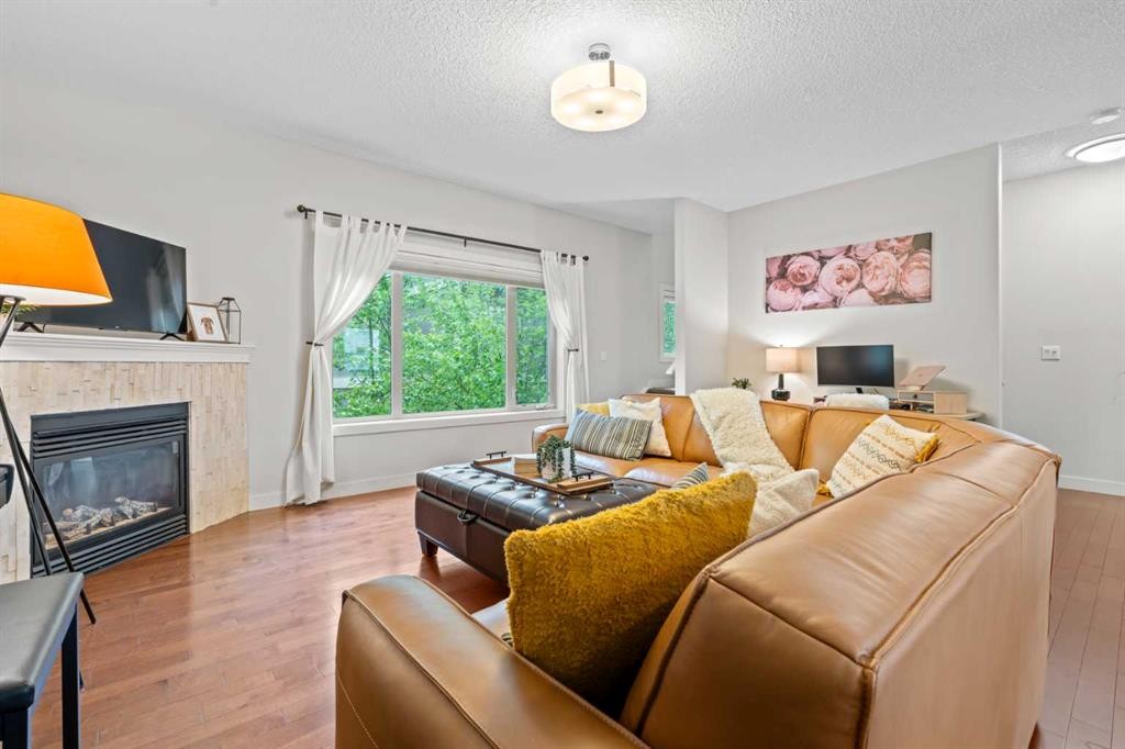 3-1916 36 Street Sw, Calgary, AB - Indoor Photo Showing Living Room With Fireplace