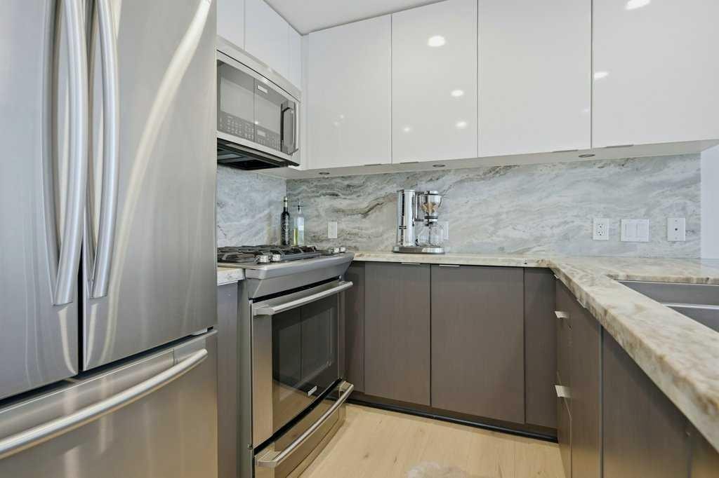 205-519 Riverfront Avenue Se, Calgary, AB - Indoor Photo Showing Kitchen With Stainless Steel Kitchen With Double Sink With Upgraded Kitchen