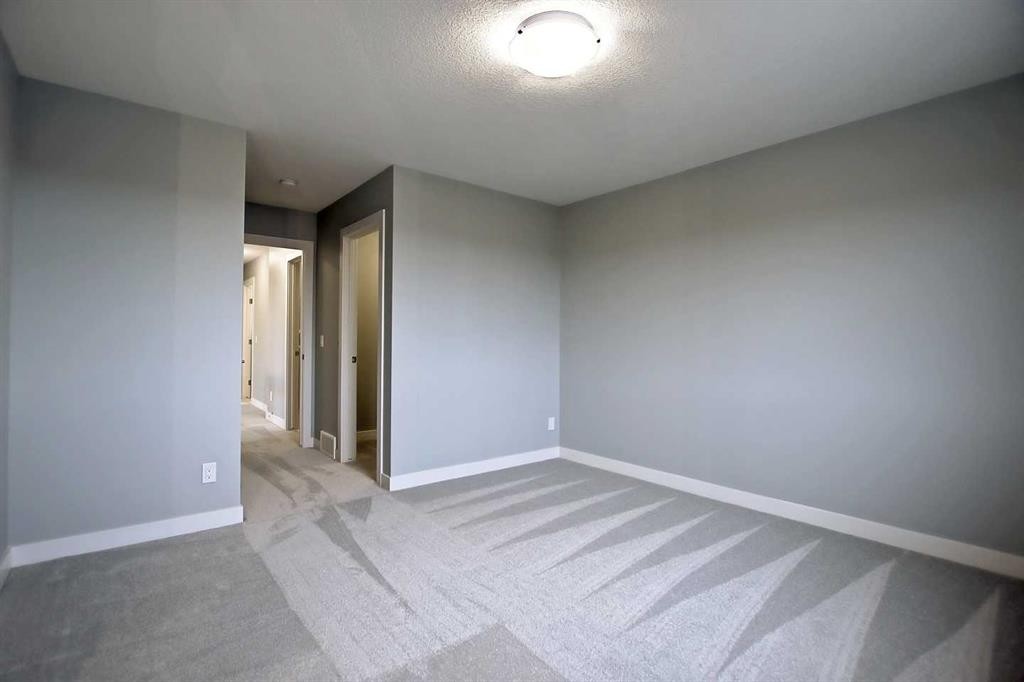 2085 Cobblespring Avenue Sw, Airdrie, AB - Indoor Photo Showing Other Room