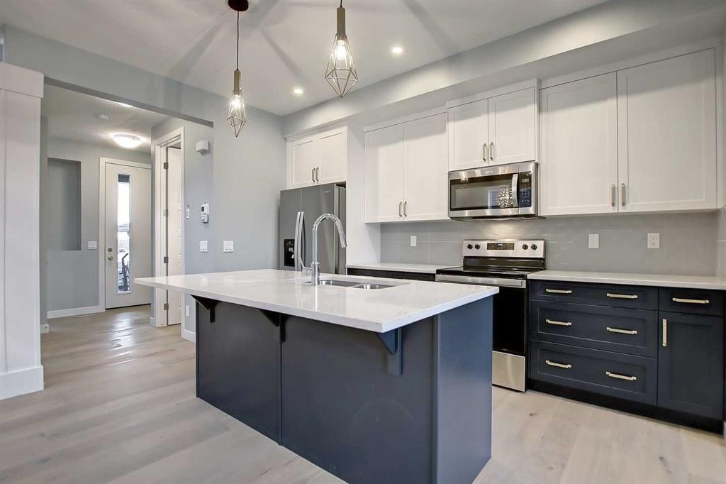 2085 Cobblespring Avenue Sw, Airdrie, AB - Indoor Photo Showing Kitchen With Stainless Steel Kitchen With Upgraded Kitchen