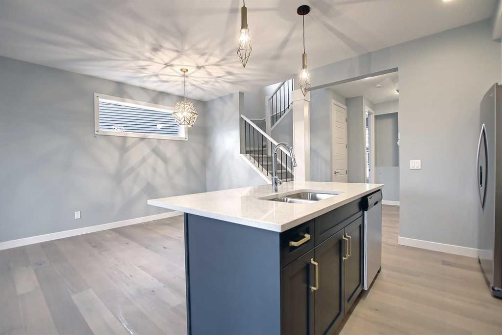 2085 Cobblespring Avenue Sw, Airdrie, AB - Indoor Photo Showing Kitchen With Double Sink