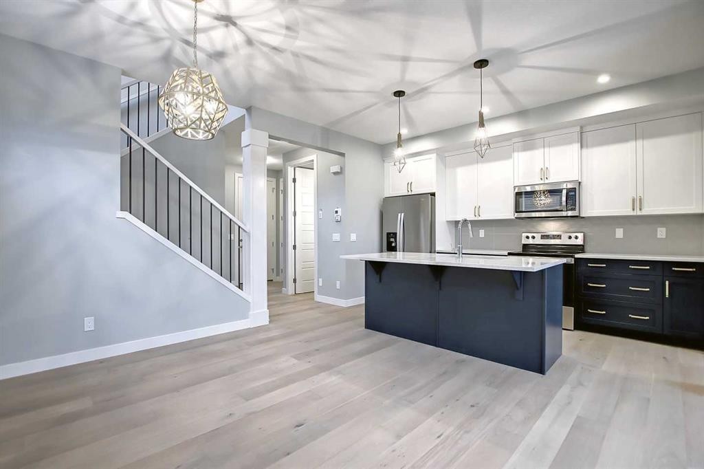 2085 Cobblespring Avenue Sw, Airdrie, AB - Indoor Photo Showing Kitchen With Stainless Steel Kitchen With Upgraded Kitchen
