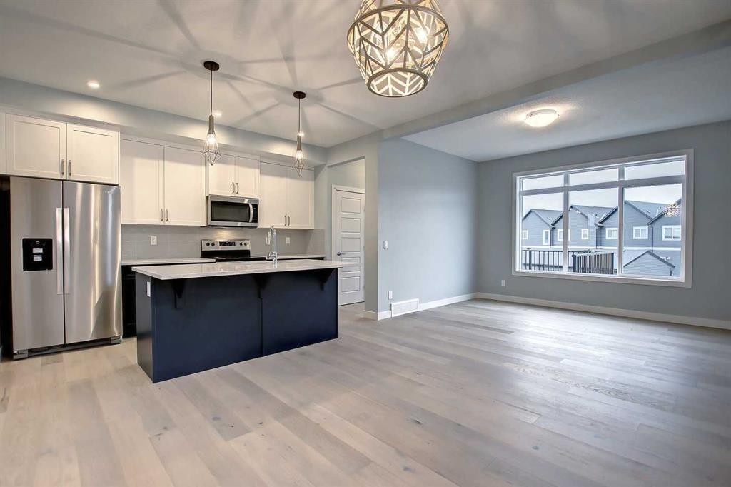 2085 Cobblespring Avenue Sw, Airdrie, AB - Indoor Photo Showing Kitchen With Stainless Steel Kitchen With Upgraded Kitchen