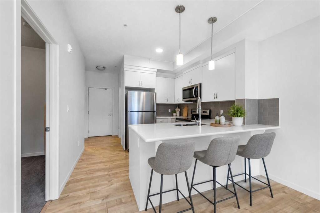 316-20 Seton Park Se, Calgary, AB - Indoor Photo Showing Kitchen With Stainless Steel Kitchen With Upgraded Kitchen