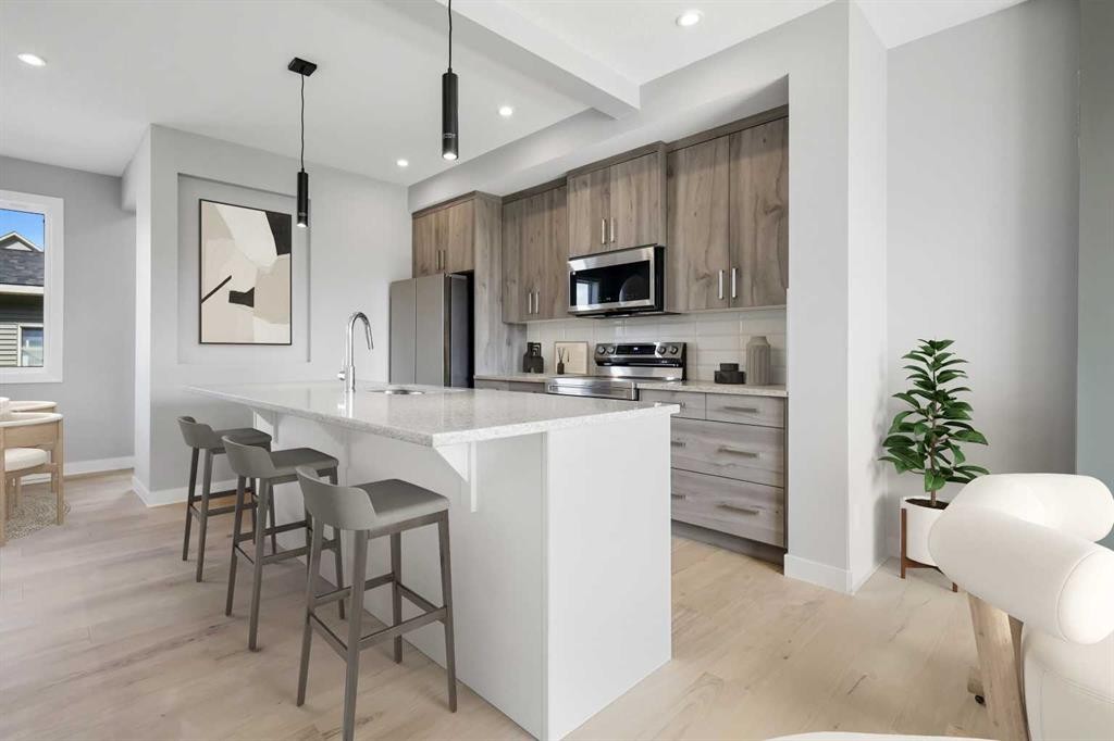 408 Waterford Boulevard, Chestermere, AB - Indoor Photo Showing Kitchen With Upgraded Kitchen