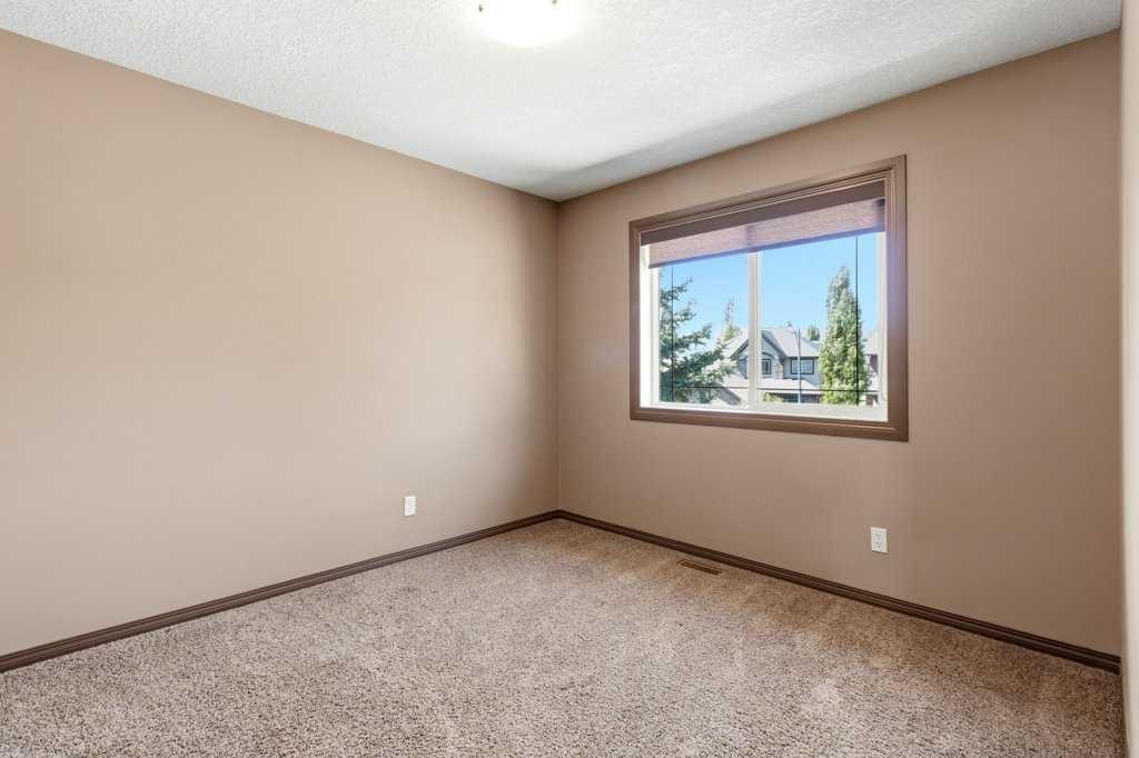 23 Aspen Stone Crescent Sw, Calgary, AB - Indoor Photo Showing Other Room