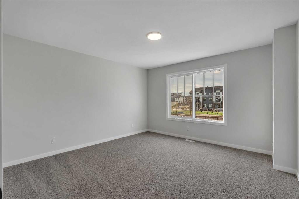 229 Heirloom Way Se, Calgary, AB - Indoor Photo Showing Other Room