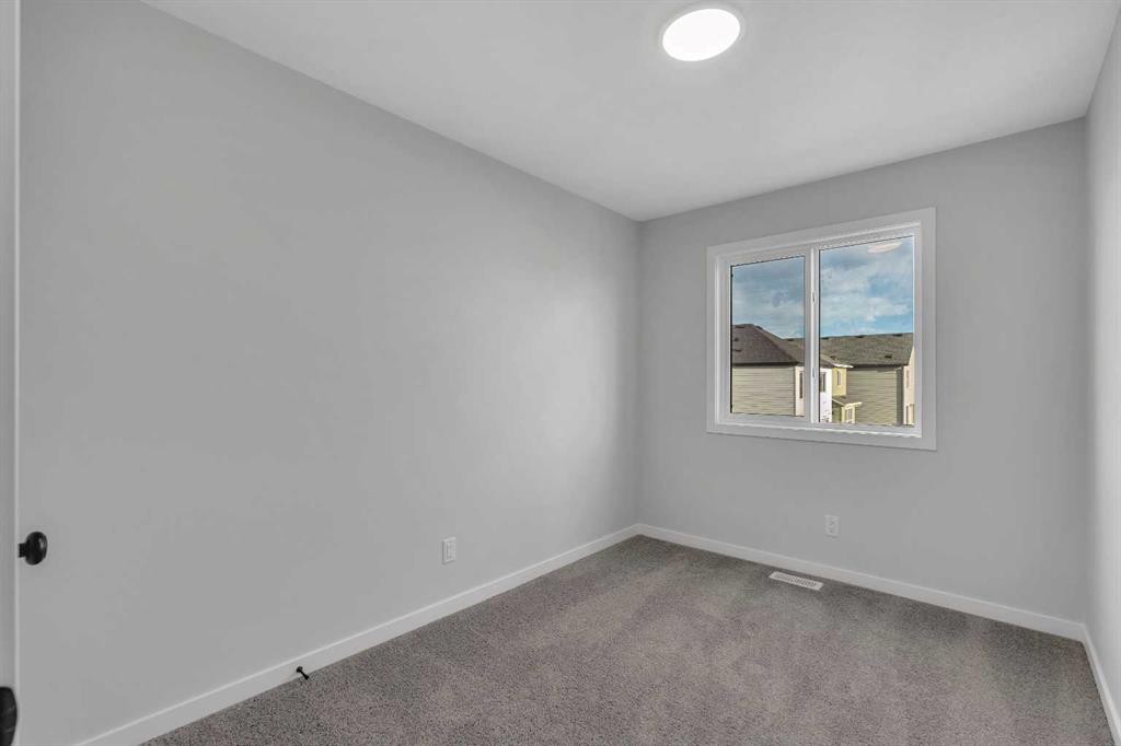 229 Heirloom Way Se, Calgary, AB - Indoor Photo Showing Other Room