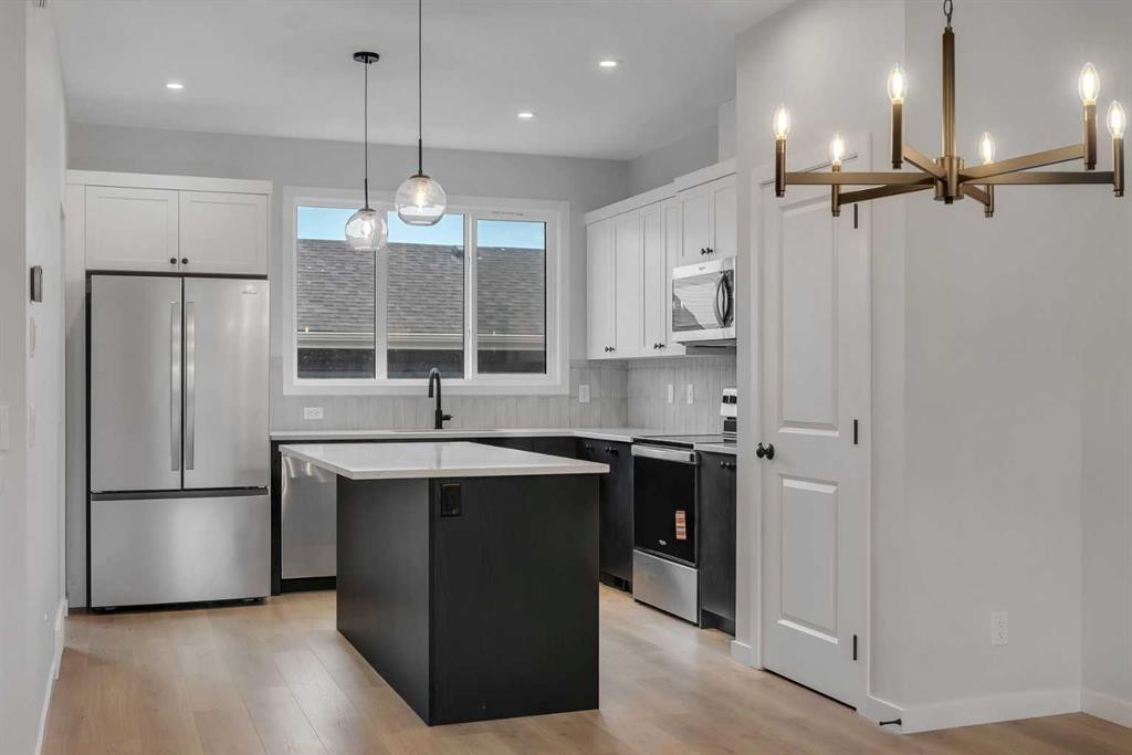229 Heirloom Way Se, Calgary, AB - Indoor Photo Showing Kitchen With Stainless Steel Kitchen With Upgraded Kitchen