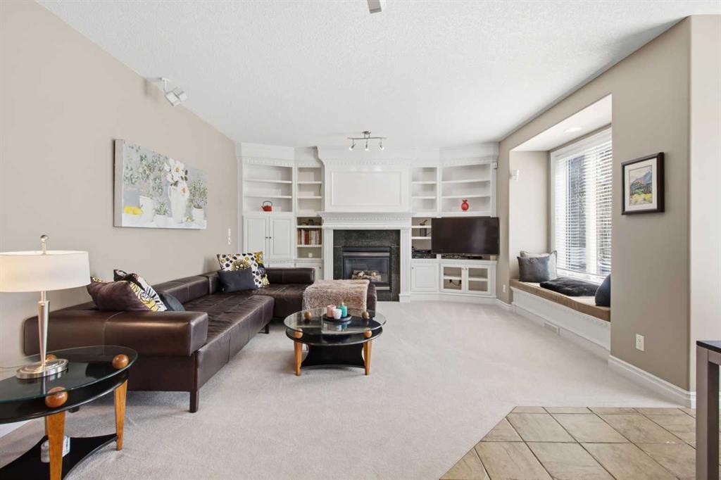 36 Hampstead Hill Nw, Calgary, AB - Indoor Photo Showing Living Room With Fireplace