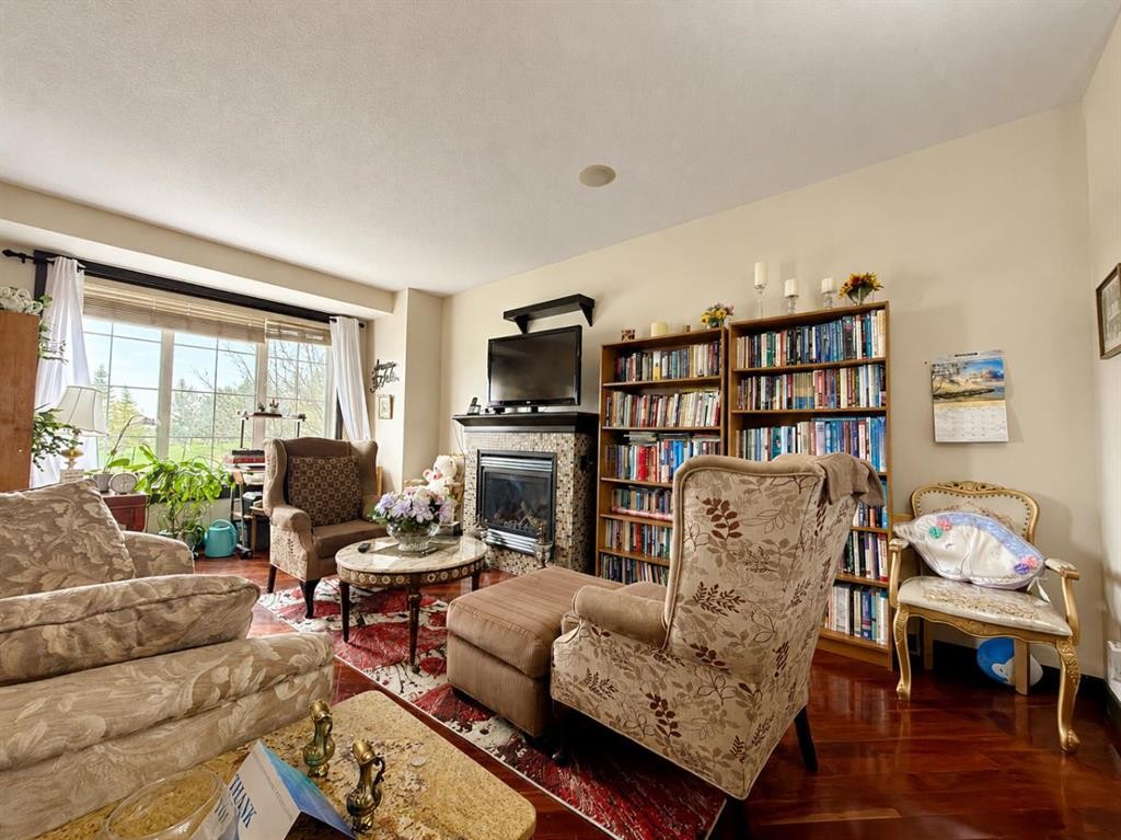 288 Rainbow Falls Drive, Chestermere, AB - Indoor Photo Showing Living Room With Fireplace