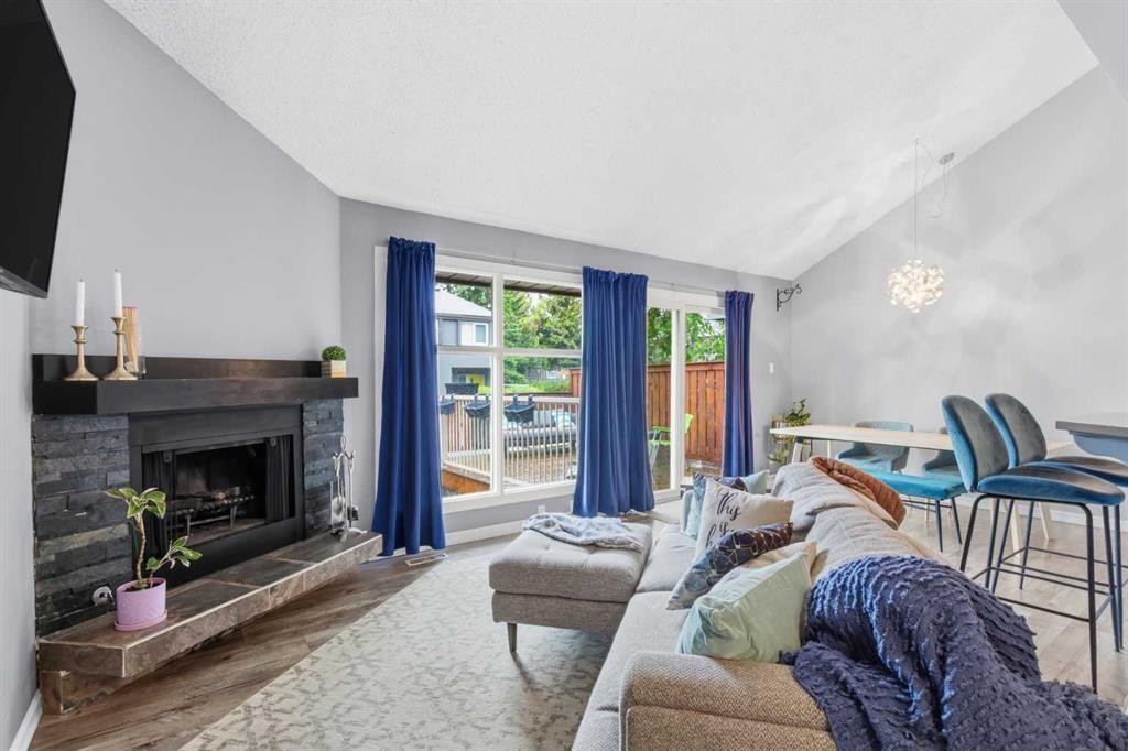 57-2225 Oakmoor Drive Sw, Calgary, AB - Indoor Photo Showing Living Room With Fireplace