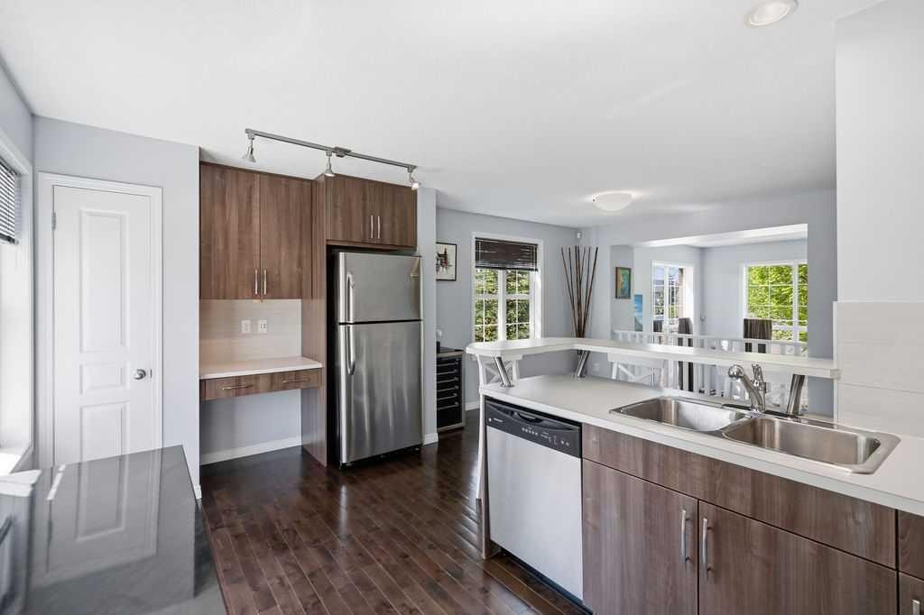 148 Cranarch Road Se, Calgary, AB - Indoor Photo Showing Kitchen With Double Sink