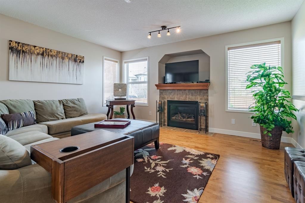6 Cranwell Link Se, Calgary, AB - Indoor Photo Showing Living Room With Fireplace