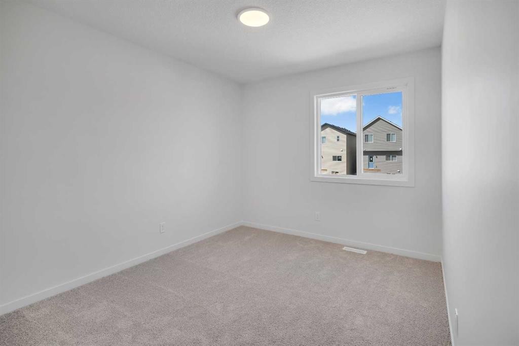 541 Bayview Street Sw, Airdrie, AB - Indoor Photo Showing Other Room