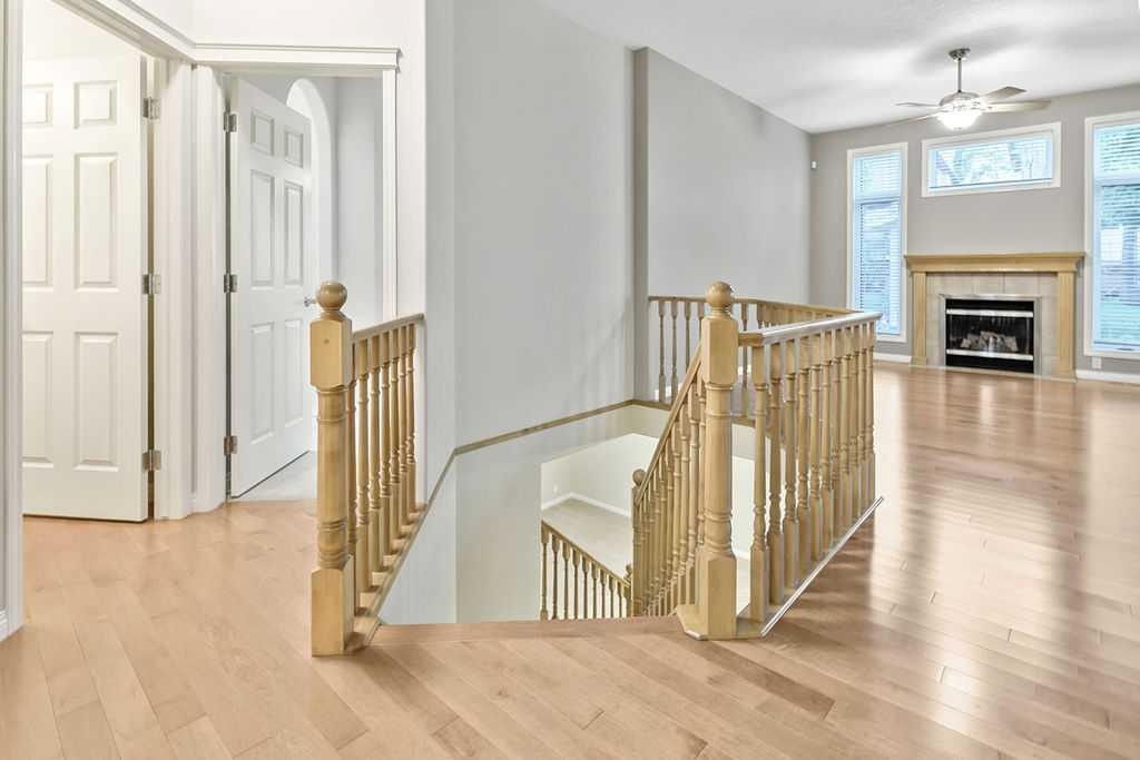 41 Cranston Drive Se, Calgary, AB - Indoor Photo Showing Other Room With Fireplace