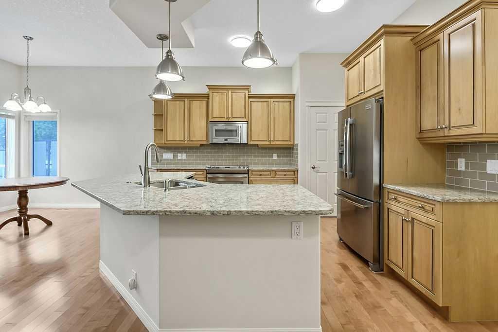 41 Cranston Drive Se, Calgary, AB - Indoor Photo Showing Kitchen With Double Sink With Upgraded Kitchen