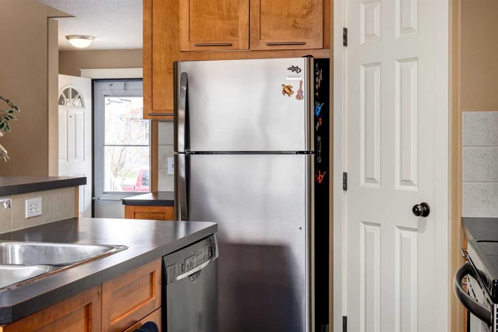 159 Cimarron Grove Crescent, Okotoks, AB - Indoor Photo Showing Kitchen With Double Sink