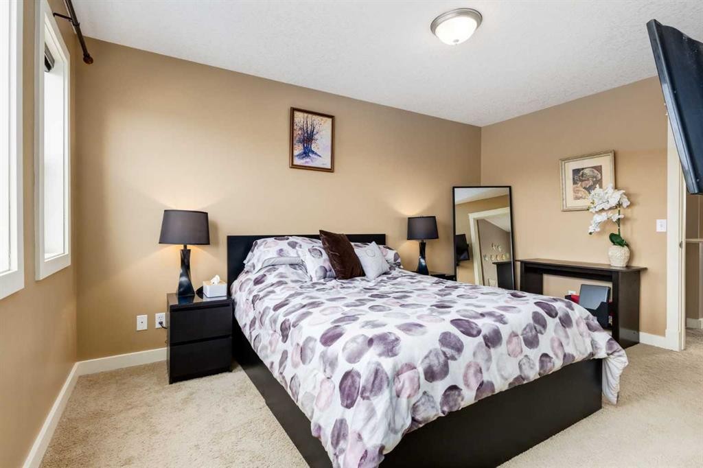 159 Cimarron Grove Crescent, Okotoks, AB - Indoor Photo Showing Bedroom