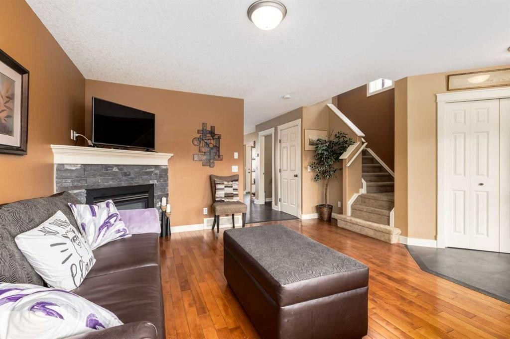 159 Cimarron Grove Crescent, Okotoks, AB - Indoor Photo Showing Living Room With Fireplace
