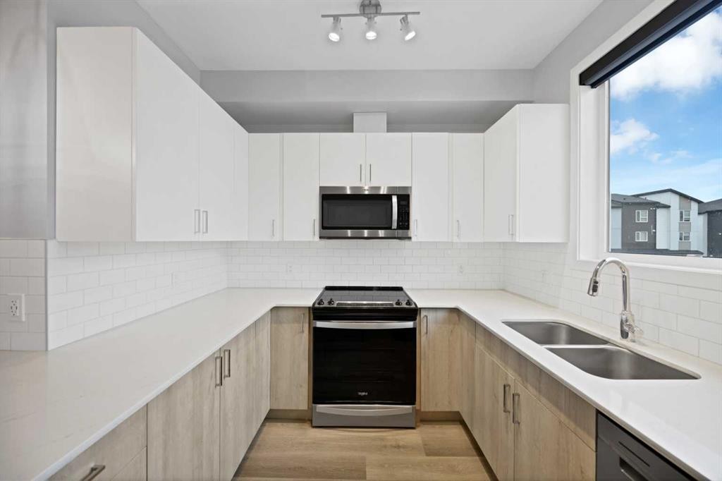 411-301 Redstone Boulevard Ne, Calgary, AB - Indoor Photo Showing Kitchen With Double Sink With Upgraded Kitchen
