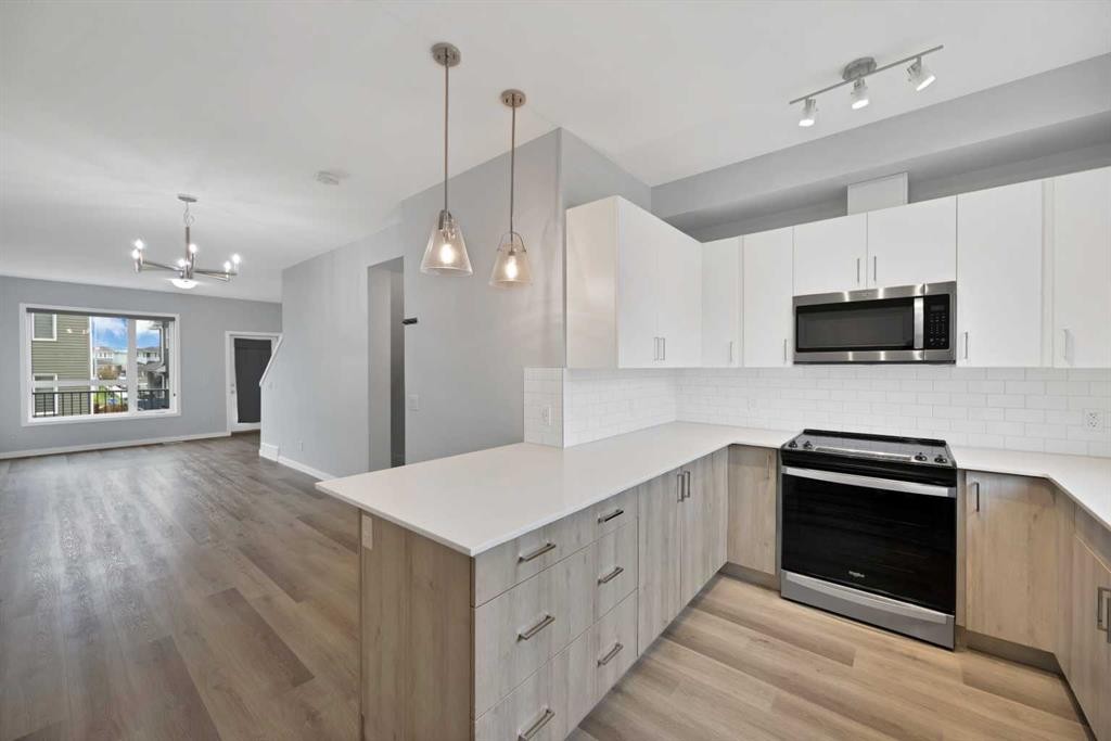 411-301 Redstone Boulevard Ne, Calgary, AB - Indoor Photo Showing Kitchen With Upgraded Kitchen
