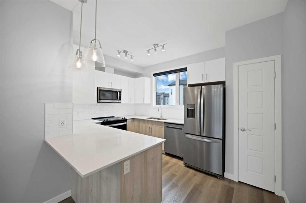411-301 Redstone Boulevard Ne, Calgary, AB - Indoor Photo Showing Kitchen With Stainless Steel Kitchen With Double Sink With Upgraded Kitchen