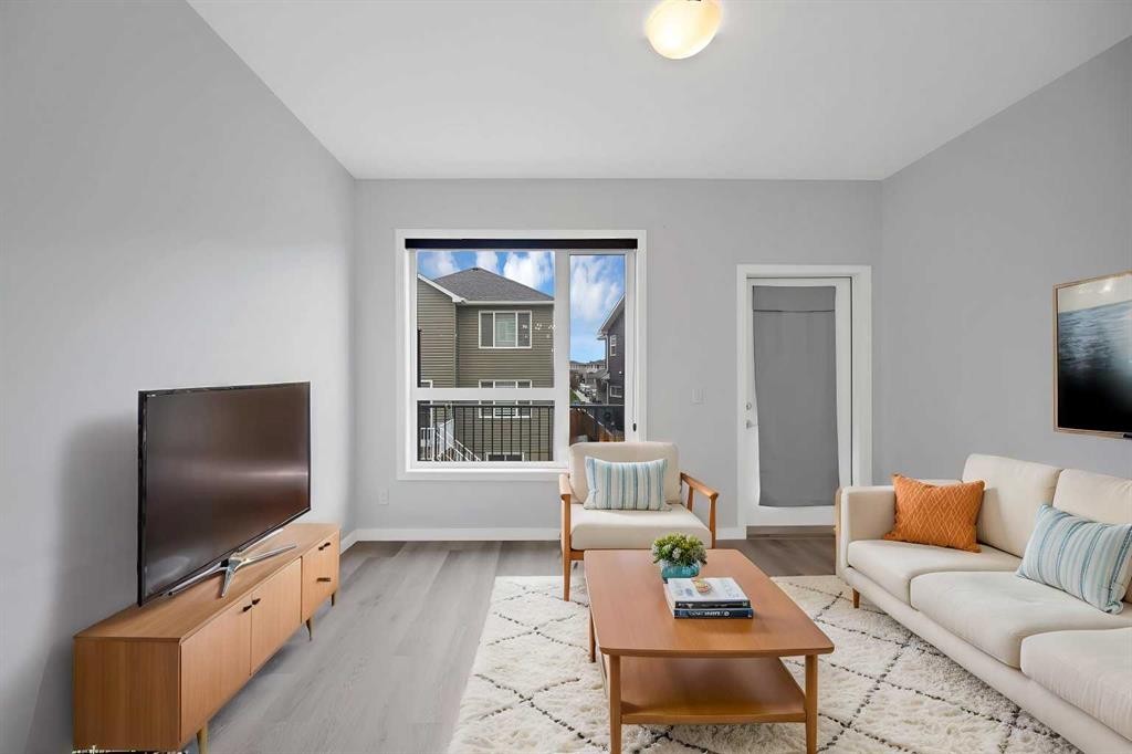 411-301 Redstone Boulevard Ne, Calgary, AB - Indoor Photo Showing Living Room