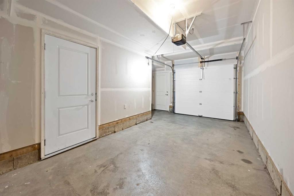 411-301 Redstone Boulevard Ne, Calgary, AB - Indoor Photo Showing Garage