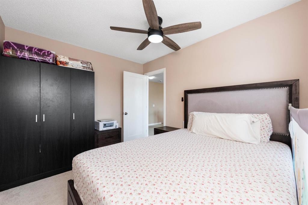 203 Morningside Circle Sw, Airdrie, AB - Indoor Photo Showing Bedroom