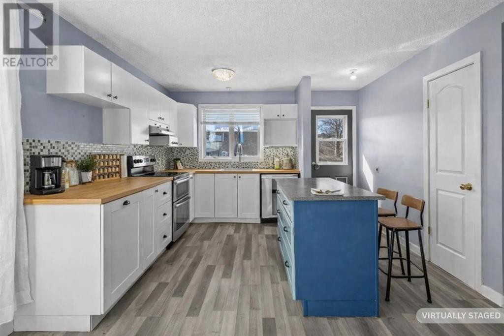 72 Marquis Place Se, Airdrie, AB - Indoor Photo Showing Kitchen With Upgraded Kitchen