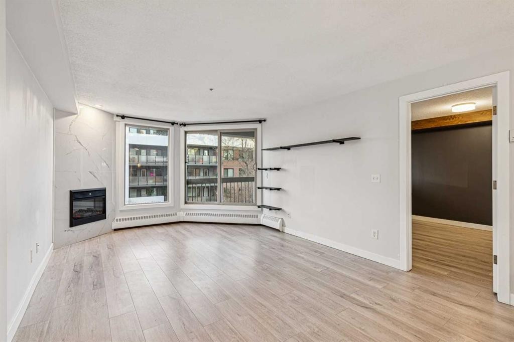 304-317 19 Avenue Sw, Calgary, AB - Indoor With Fireplace