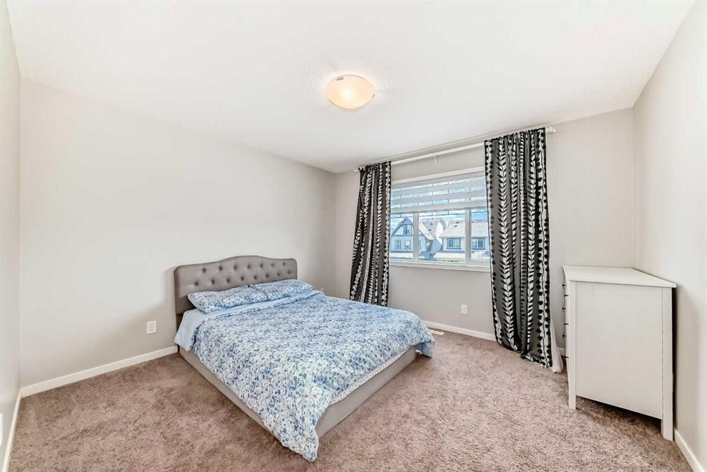 151 Copperpond Rise Se, Calgary, AB - Indoor Photo Showing Bedroom
