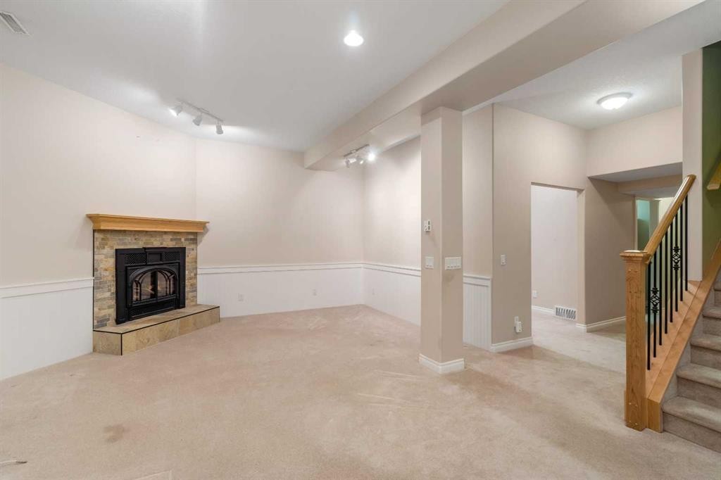35 Prominence Path Sw, Calgary, AB - Indoor Photo Showing Other Room With Fireplace