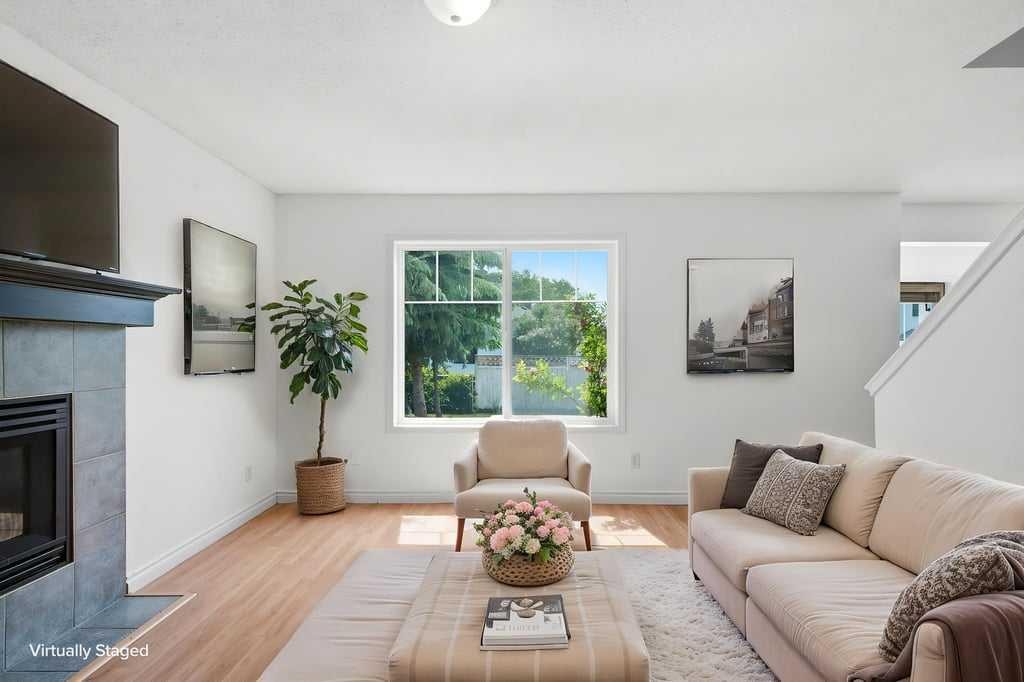 690 Coventry Drive Ne, Calgary, AB - Indoor Photo Showing Living Room With Fireplace